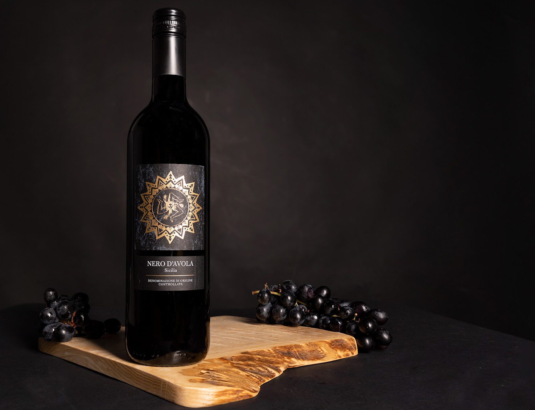 A commercial studio photo example of a red wine and black background.